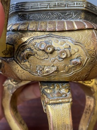 A Chinese gilt bronze tripod censer, 18/19th C.