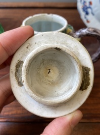 A Chinese clobbered blue and white ewer, a plate and a verte biscuit teapot, Kangxi