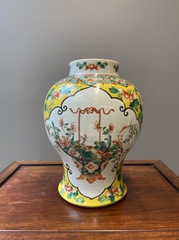 Three Chinese blue, white and famille verte vases, 19th C.