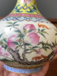 A small Chinese famille rose 'nine peaches' bottle vase, Jiaqing mark, 20th C.