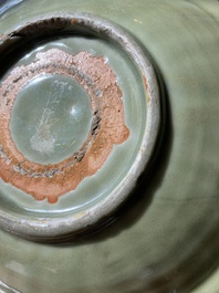 A Chinese Longquan celadon lotus-form dish with underglaze floral design, Ming