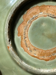 A Chinese Longquan celadon lotus-form dish with underglaze floral design, Ming