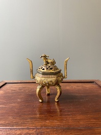 A Chinese gilt bronze tripod censer, 18/19th C.