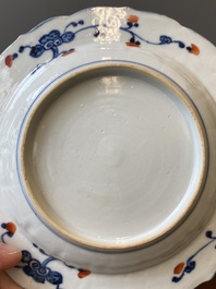A Chinese clobbered blue and white ewer, a plate and a verte biscuit teapot, Kangxi