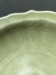 A Chinese Longquan celadon lotus-form dish with underglaze floral design, Ming