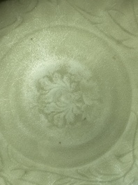 A Chinese Longquan celadon lotus-form dish with underglaze floral design, Ming