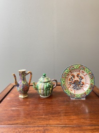 A Chinese clobbered blue and white ewer, a plate and a verte biscuit teapot, Kangxi