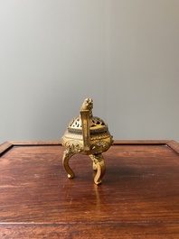 A Chinese gilt bronze tripod censer, 18/19th C.