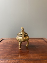 A Chinese gilt bronze tripod censer, 18/19th C.