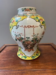 Three Chinese blue, white and famille verte vases, 19th C.