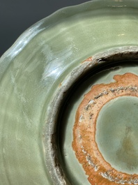 A Chinese Longquan celadon lotus-form dish with underglaze floral design, Ming