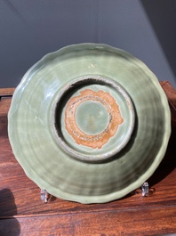 A Chinese Longquan celadon lotus-form dish with underglaze floral design, Ming