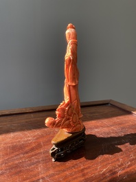 A Chinese red coral figure of a lady with a fan, 19/20th C.