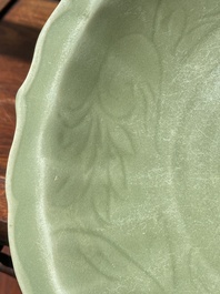 A Chinese Longquan celadon lotus-form dish with underglaze floral design, Ming
