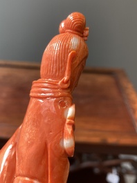 A Chinese red coral figure of a lady with a fan, 19/20th C.