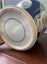 A pair of Chinese powder-blue-ground famille verte vases and covers, 19th C.