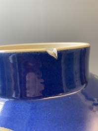 A pair of Chinese powder-blue-ground famille verte vases and covers, 19th C.
