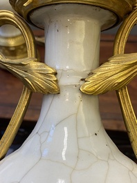 A pair of Chinese gilt bronze lamp-mounted crackle-glazed vases, 18/19th C.