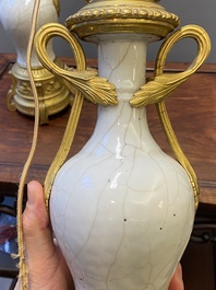 A pair of Chinese gilt bronze lamp-mounted crackle-glazed vases, 18/19th C.