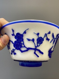 A Chinese overlay Beijing glass 'magpie and plum blossom' bowl in blue on white, 19th C.
