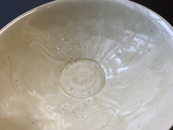 A Chinese qingbai-glazed 'phoenixes' bowl and a cream-glazed 'fish' bowl, probably Song