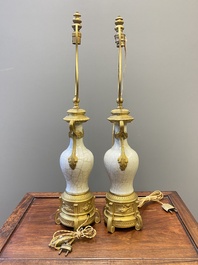 A pair of Chinese gilt bronze lamp-mounted crackle-glazed vases, 18/19th C.