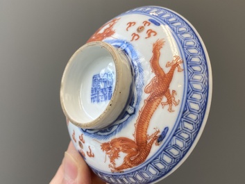A Chinese blue, white and iron-red 'dragon' bowl and cover and a wine cup, Qianlong mark, 18/19th C.