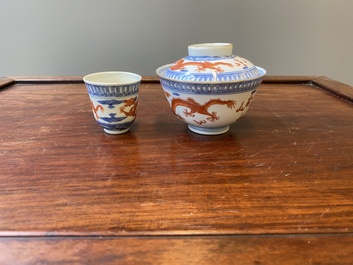 A Chinese blue, white and iron-red 'dragon' bowl and cover and a wine cup, Qianlong mark, 18/19th C.