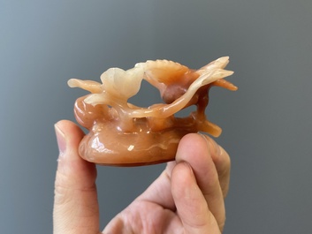 A Chinese carnelian agate sculpture of a vase with branches and birds, 20th C.