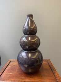A large Chinese aubergine-glazed triple gourd vase, 18th C.