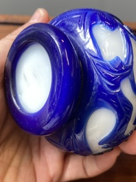 A Chinese overlay Beijing glass bottle vase with lotus scrolls in blue on white, 19th C.