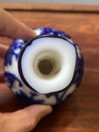 A Chinese overlay Beijing glass bottle vase with lotus scrolls in blue on white, 19th C.