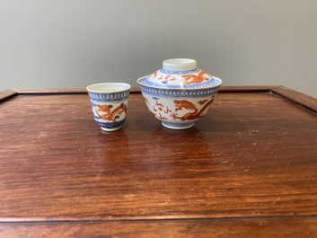 A Chinese blue, white and iron-red 'dragon' bowl and cover and a wine cup, Qianlong mark, 18/19th C.