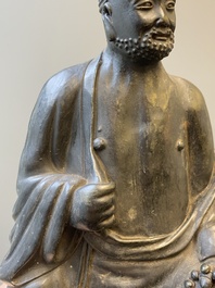 A Chinese monochrome black-glazed figure of Ji Gong, 18th C.