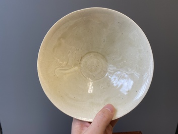 A Chinese qingbai-glazed 'phoenixes' bowl and a cream-glazed 'fish' bowl, probably Song