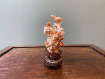 A Chinese carnelian agate sculpture of a vase with branches and birds, 20th C.