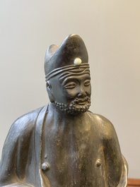 A Chinese monochrome black-glazed figure of Ji Gong, 18th C.