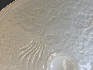 A Chinese qingbai-glazed 'phoenixes' bowl and a cream-glazed 'fish' bowl, probably Song