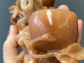 A Chinese carnelian agate sculpture of a vase with branches and birds, 20th C.