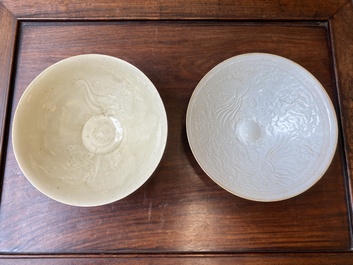 A Chinese qingbai-glazed 'phoenixes' bowl and a cream-glazed 'fish' bowl, probably Song