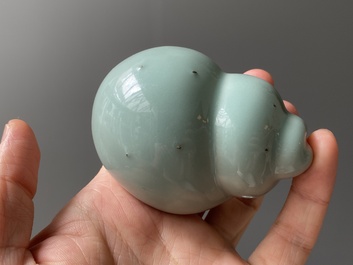 A Chinese celadon-glazed water pot on wooden stand and a small 'hu' vase, 19/20th C.