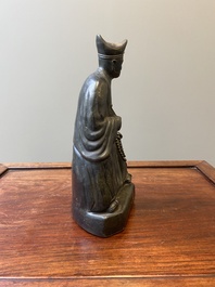 A Chinese monochrome black-glazed figure of Ji Gong, 18th C.