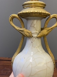 A pair of Chinese gilt bronze lamp-mounted crackle-glazed vases, 18/19th C.