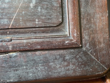 A Chinese relief-decorated famille verte 'peacock' plaque in a fine carved hongmu wooden frame, 19th C.