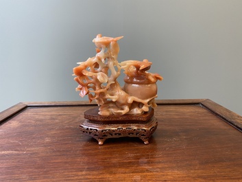 A Chinese carnelian agate sculpture of a vase with branches and birds, 20th C.