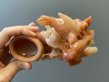 A Chinese carnelian agate sculpture of a vase with branches and birds, 20th C.