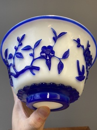 A Chinese overlay Beijing glass 'magpie and plum blossom' bowl in blue on white, 19th C.