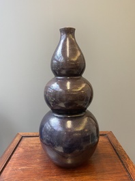 A large Chinese aubergine-glazed triple gourd vase, 18th C.