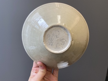A Chinese qingbai-glazed 'phoenixes' bowl and a cream-glazed 'fish' bowl, probably Song