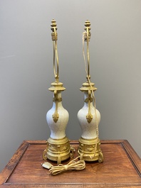 A pair of Chinese gilt bronze lamp-mounted crackle-glazed vases, 18/19th C.